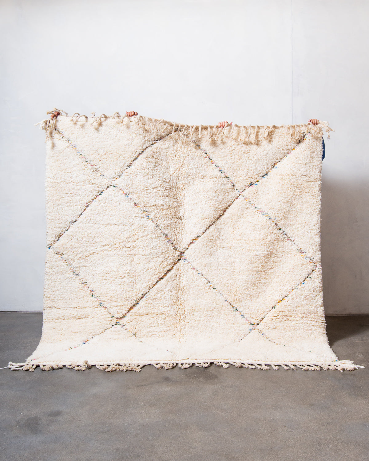 Modern, designer, handcrafted Berber rug from Morocco. Beniourain carpet with beautiful colours and patterns and fluffy wool texture.